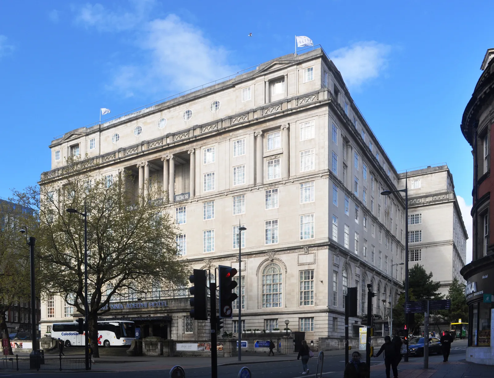 The Portland-stone front of the Adelphi Hotel on Ranelagh Place, seen from across the road on a clear day