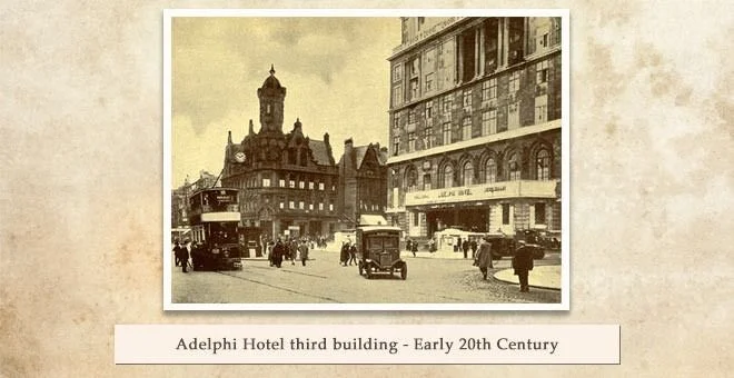 Sepia view of the third Adelphi Hotel building in the early 20th century, with a tram and an early motor car on the street beside it