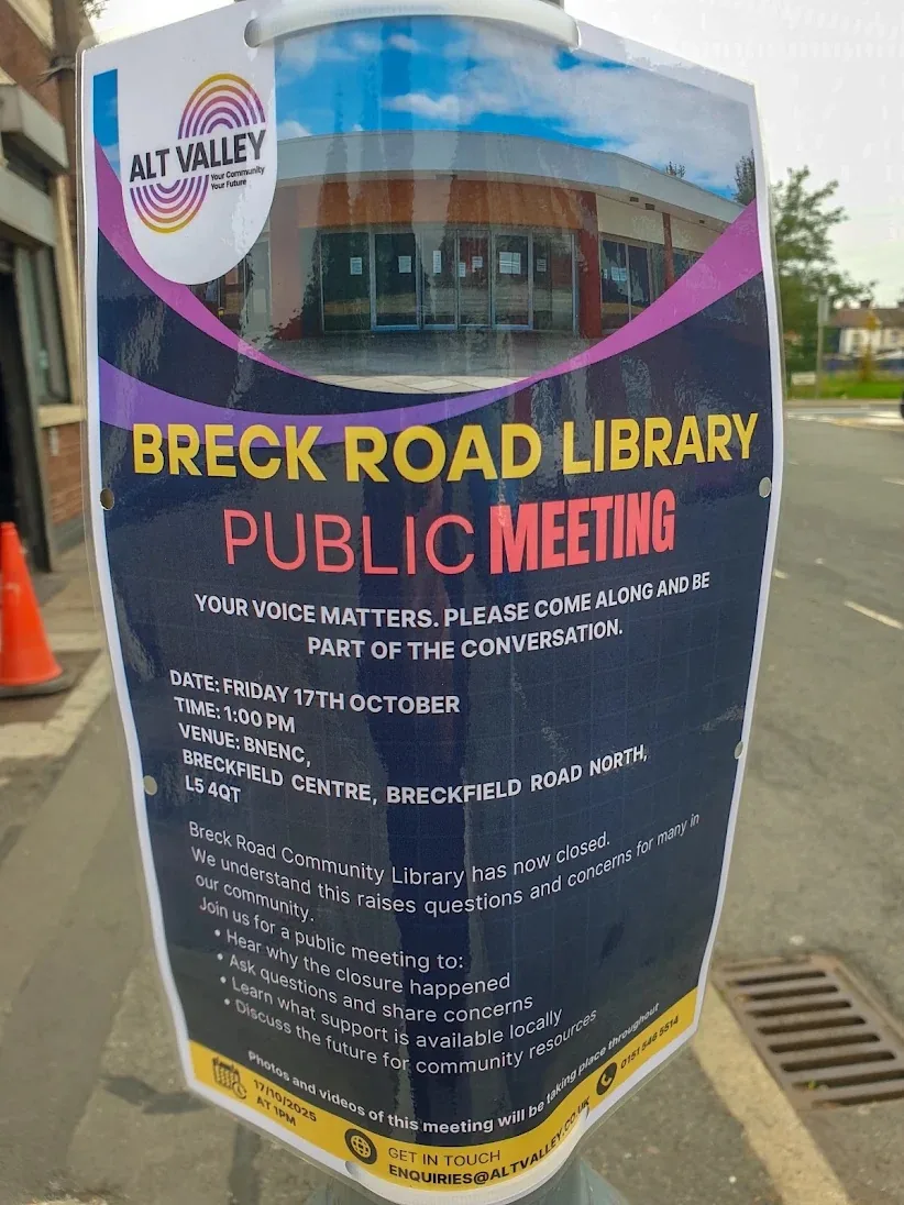 An Alt Valley Community Trust poster on a lamp post announcing a public meeting about the closure of Breck Road Library