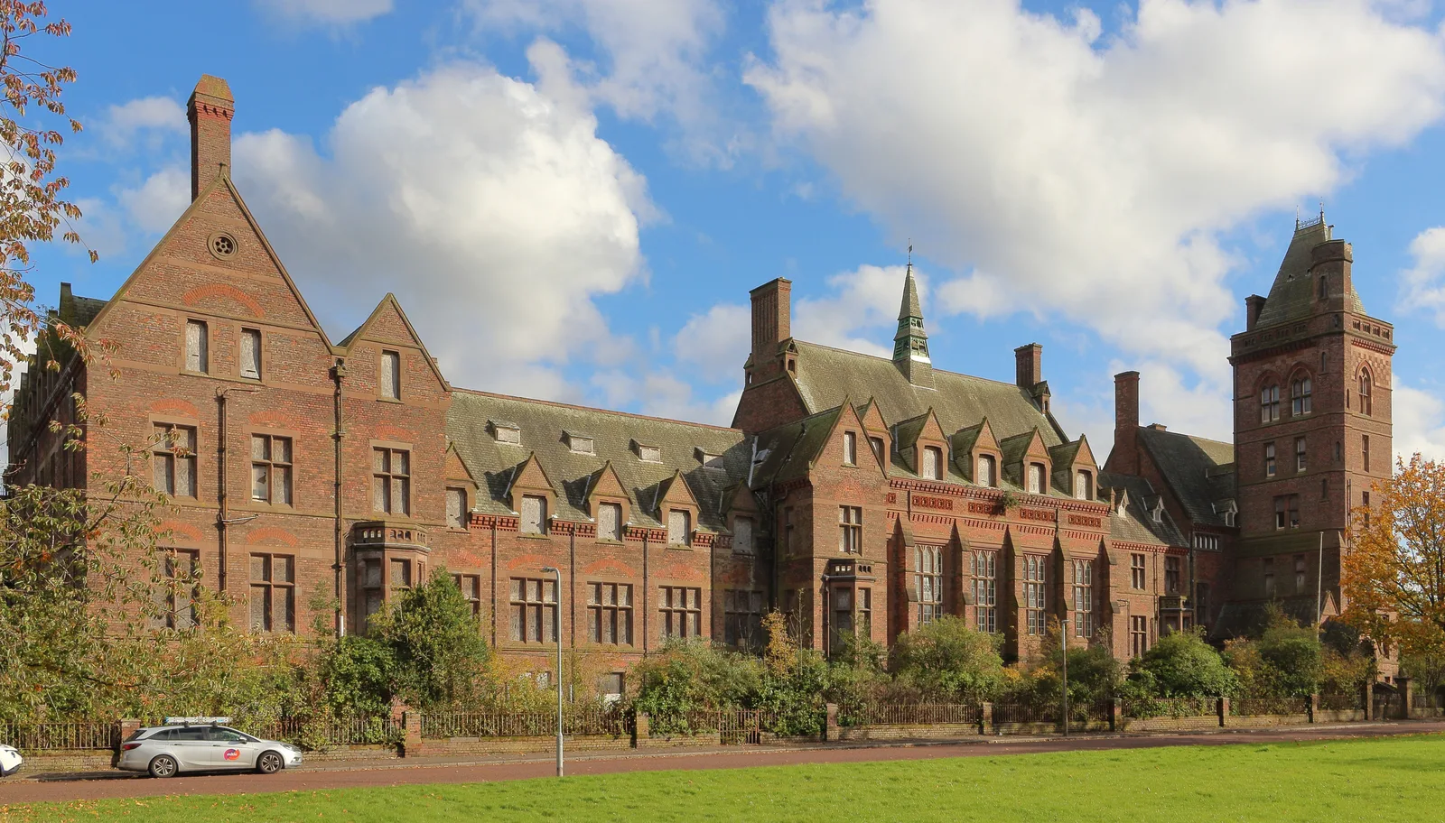 The Victorian red-brick former Newsham Park Hospital building beside Newsham Park in Liverpool