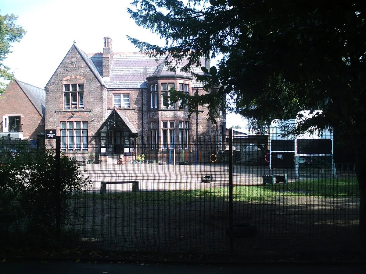 The main building of Liverpool College, a large red-brick school building in Mossley Hill