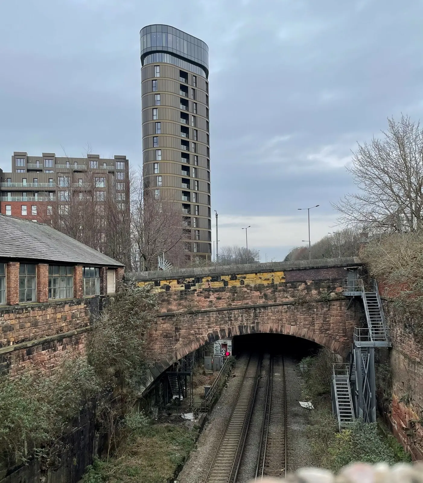Railway cutting and overgrown embankment at the former St James station site in Liverpool
