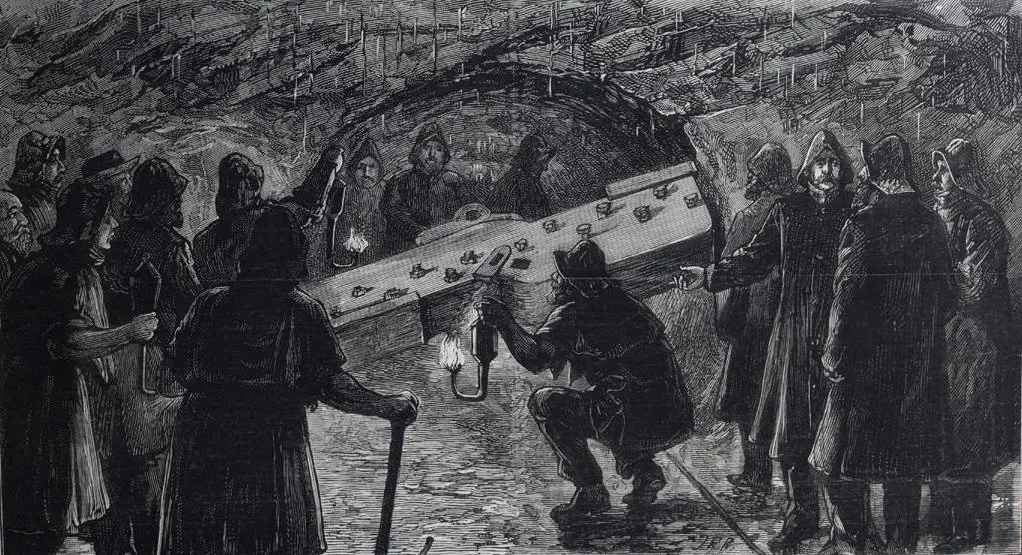 Engraving of workers with lamps at the moment the two headings of the Mersey Railway tunnel met underground