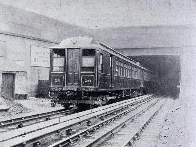 Engraving of an early electric train emerging from the mouth of the Mersey Railway tunnel in 1903