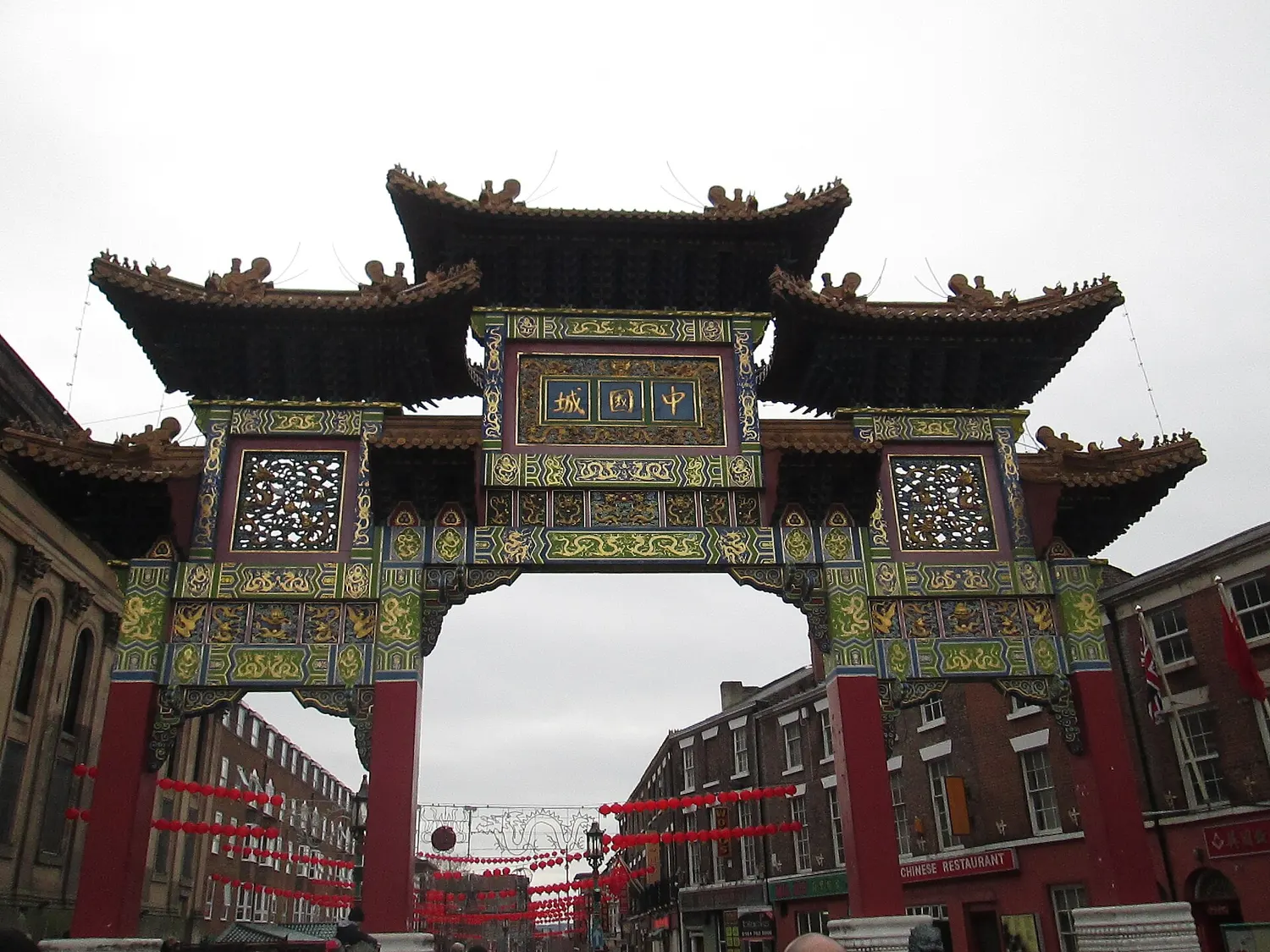 The ornate Chinese Imperial Arch on Nelson Street in Liverpool, painted red and gold