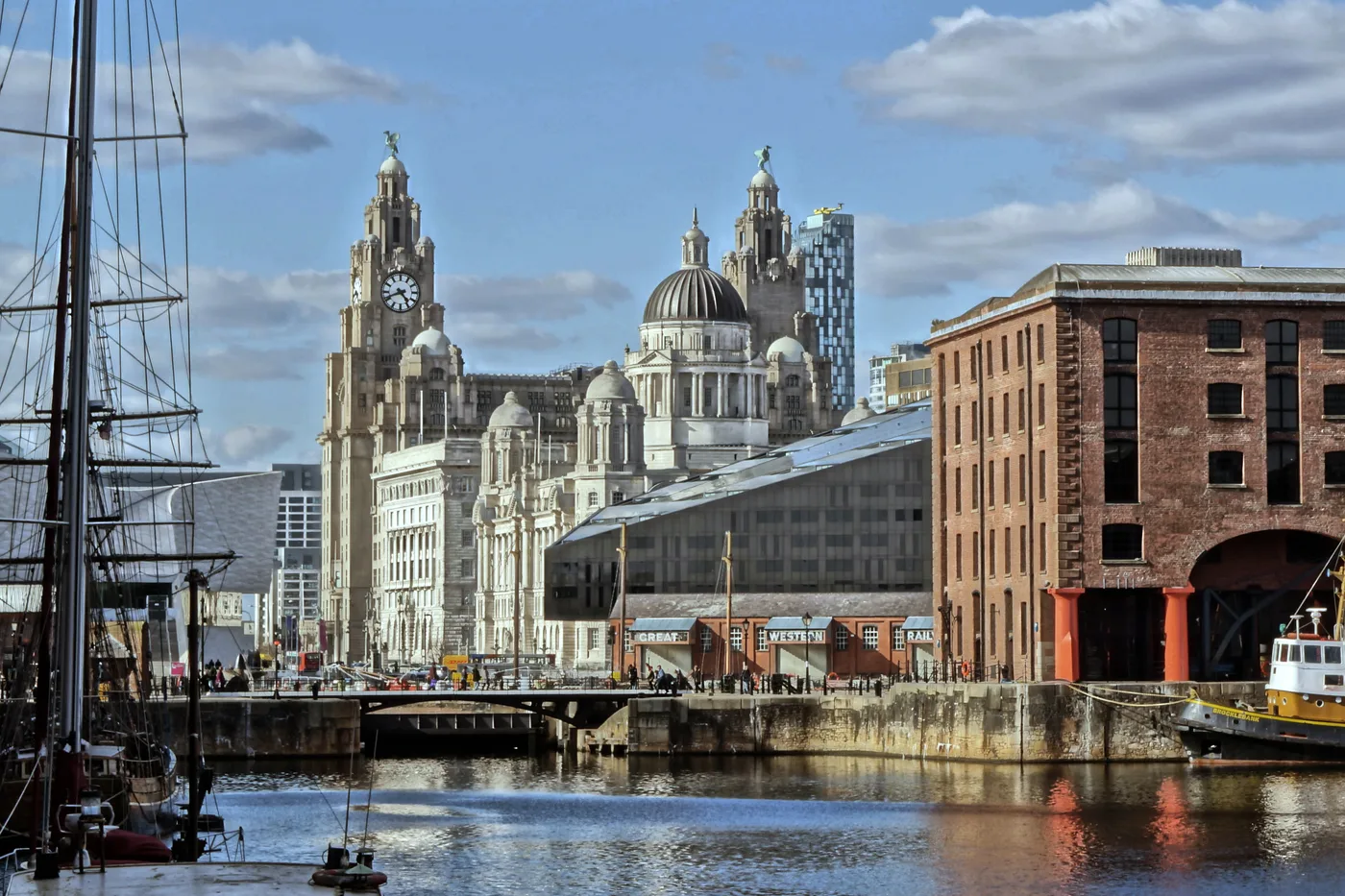 The Three Graces at Liverpool Pier Head viewed across the water from Royal Albert Dock