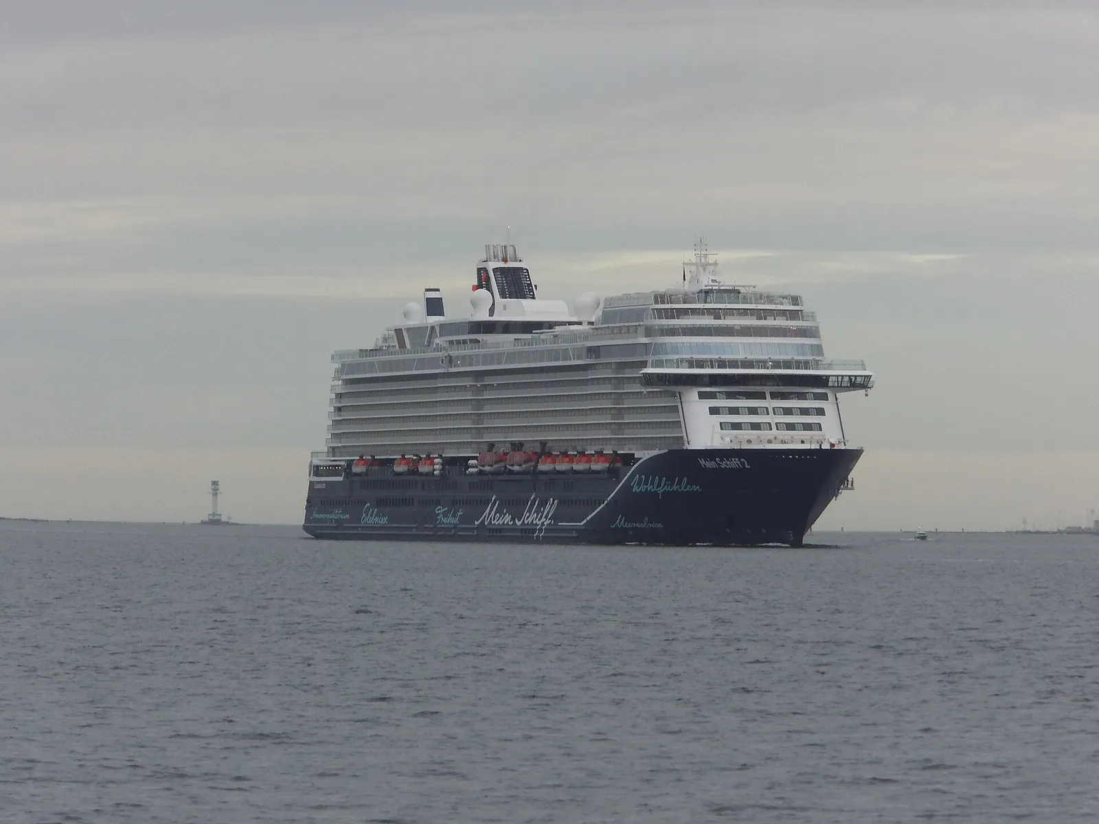 The TUI cruise ship Mein Schiff 2 at sea with its name painted along the white hull