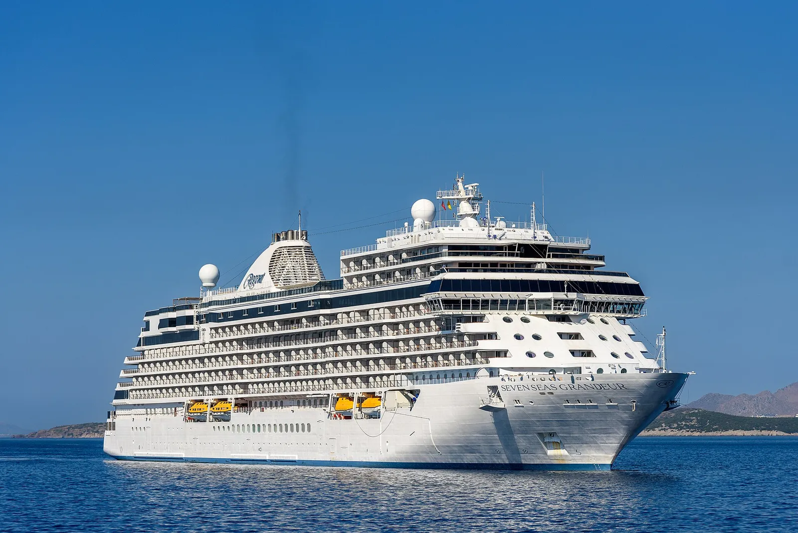 The cruise ship Seven Seas Grandeur under way on calm blue water