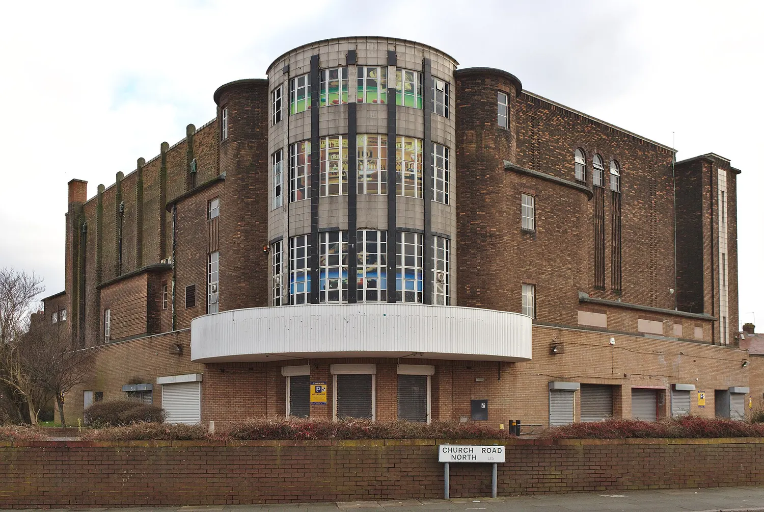 The former Abbey Cinema in Wavertree, a large curved cream building on the corner of Childwall Road and Church Road North