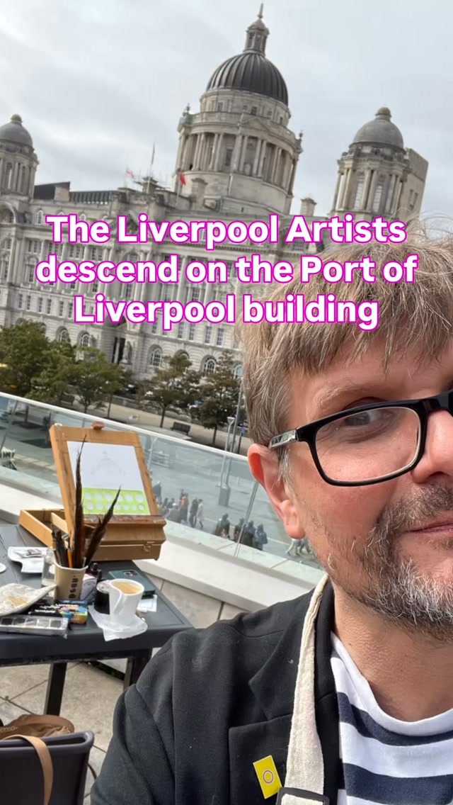 A Liverpool Artists member painting outdoors on a table easel, with the Port of Liverpool Building behind him