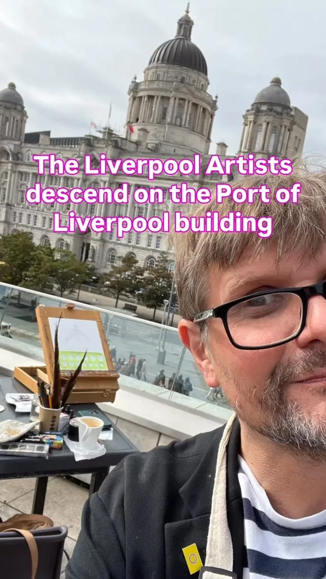A member of The Liverpool Artists painting outdoors with the Port of Liverpool Building behind him