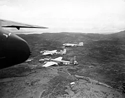 Aircraft parked on an airfield, seen from the window of another aircraft