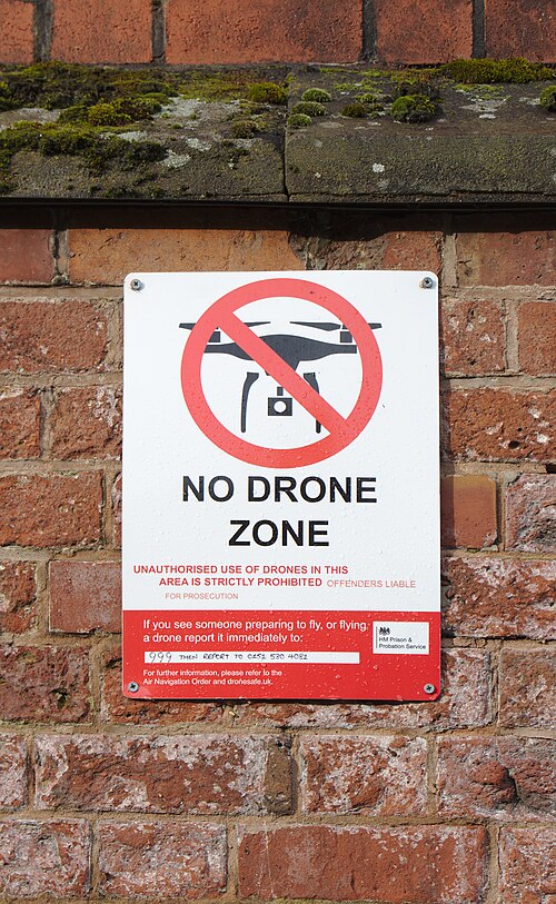 A no drone zone sign on the perimeter wall at HMP Liverpool