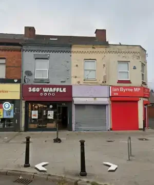 Ian Byrne's constituency office on West Derby Road with neighbouring shopfronts.