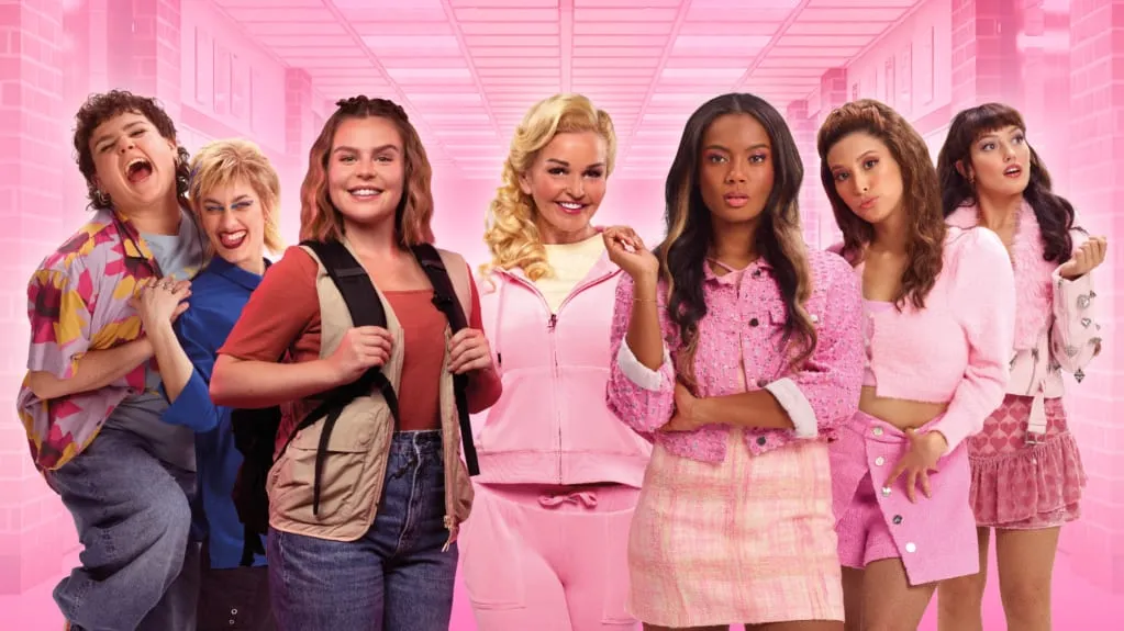 The cast of Mean Girls the Musical in pink school-corridor costumes